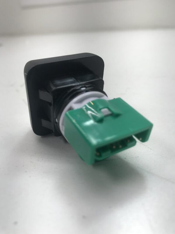 A green and white Gamesman GPB350 Button Complete w/ Small square, Z switch, and 12v LED. 1 inch on a white surface.
