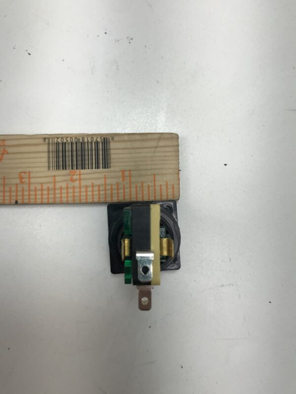A small piece of metal next to a ruler: Gamesman Buttons- 570 Series. 2 inch button length. GETT Part BTN142.