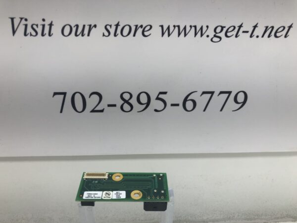 A sign in front of a Button Controller Card for IGT Dynamic Buttons that says visit our website.