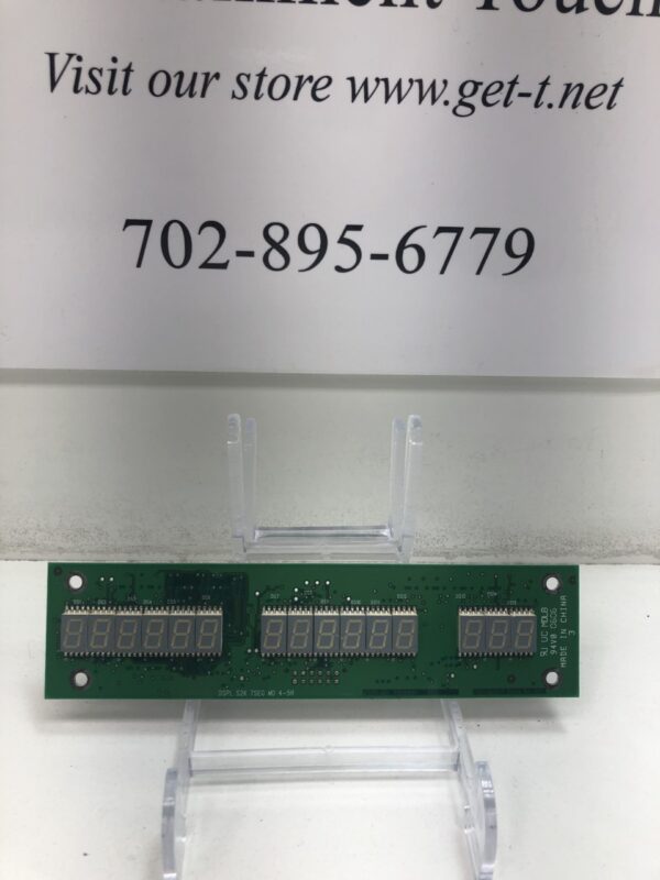 A Credit Meter - Display Board for use with IGT S2000 Game, Seven Segment - IGT S2000 IGT Part 75128301. GETT Part CM104 for a store with a sign on it.