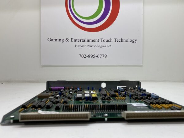 A Bally S6000 CPU, Complete, Bally Part AS-3356-0424. GETT Part CPU140 board in front of a sign.