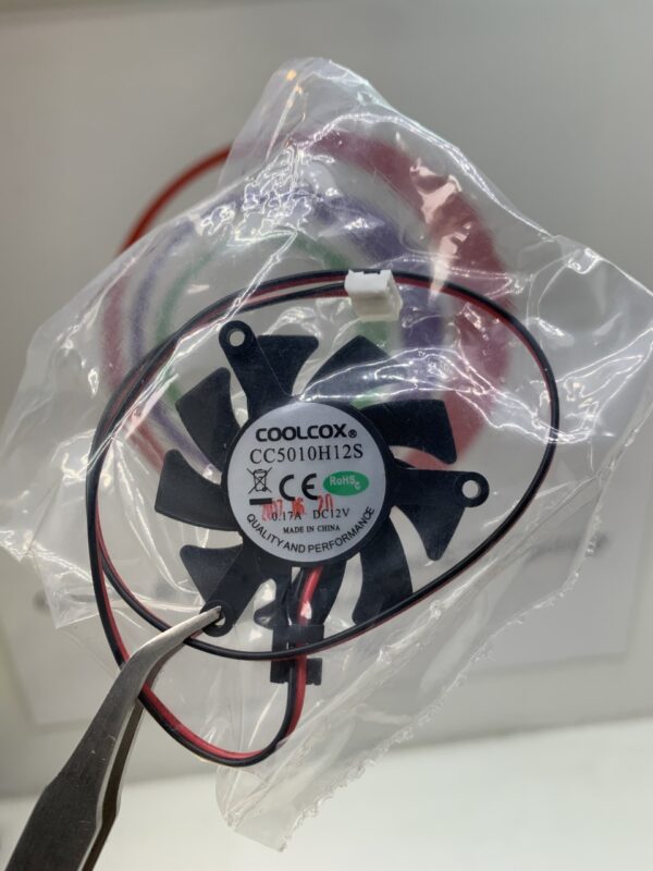 A Cooling Fan in a plastic bag. CoolCox Brand- Part # CC5010H12S, Frameless, 12v x .17A, 2 Wire, 50 x 50 x 10. NEW. GETT Part Fan161.