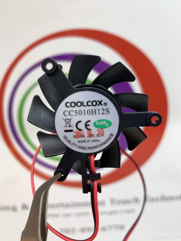 A small Cooling Fan from the CoolCox brand with a wire attached to it.