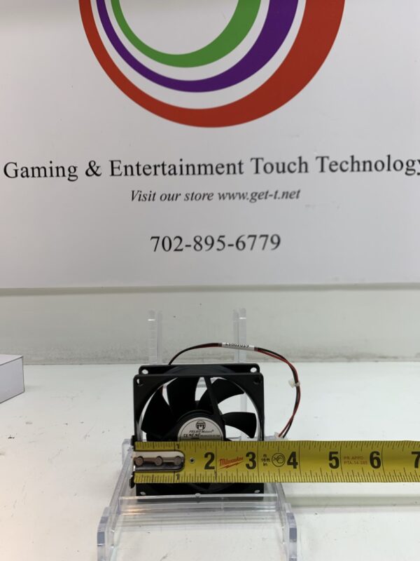 A gaming and entertainment Cooling Fan in front of a measuring tape.