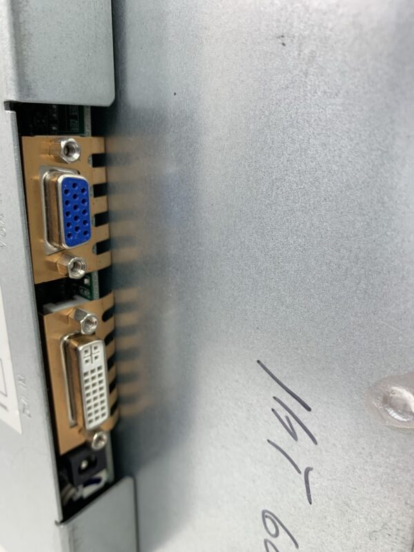 A close up of a metal box with a 20.1" LCD Non-Touch Monitor Fits IGT G20 games with 20.1" LCD Monitor. 16x10 wide format GETT Part LCDM1024 attached to it.