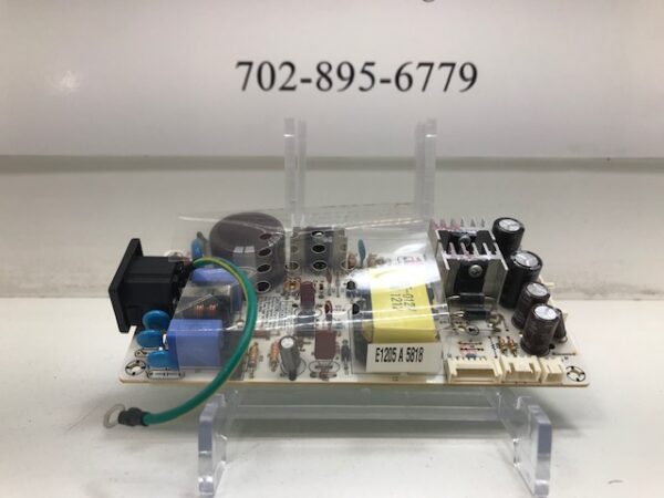 A Power Supply for 23" Effinet Monitor with electronic components on it.