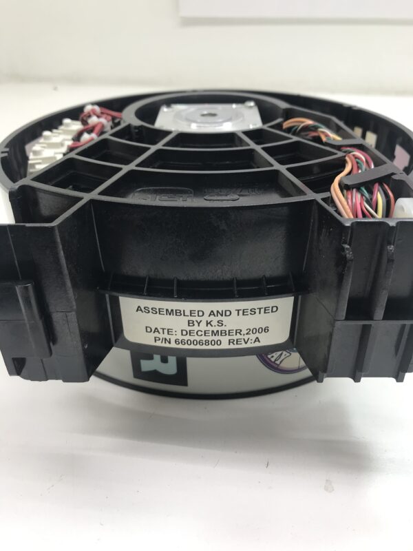 A small Reel Assembly for IGT AVP Game with wires attached to it.