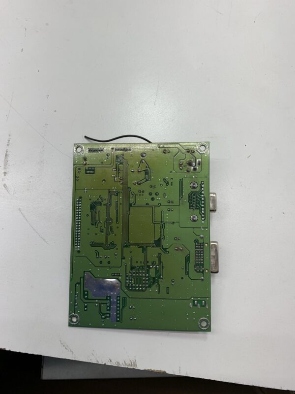 A green A-D Board for WMS BBI LCD Monitor, Fits Kristel. Kristel part 100100G001. GETT Part ADB261 sitting on a table.