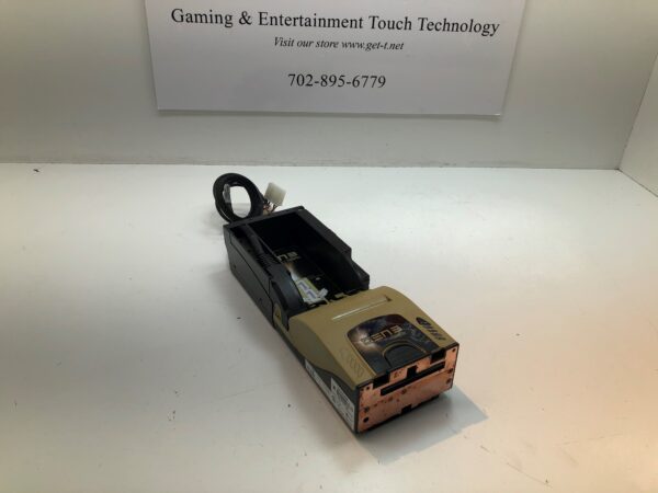 A small Transact Gen 3 Ticket Printer for use with RS232 games sitting on a table in front of a sign.