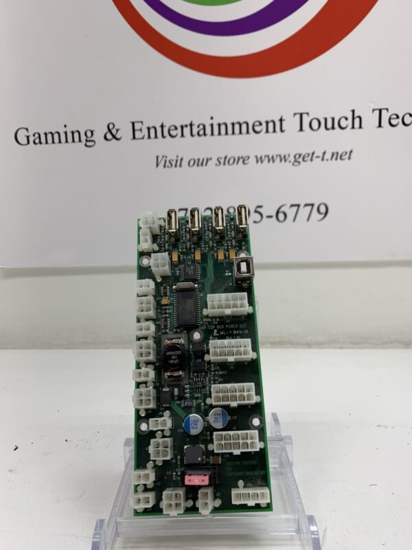 A Power Distribution Board for IGT AVP Top Box Only, IGT Part 75829200. GETT Part PDB114 in front of a sign.