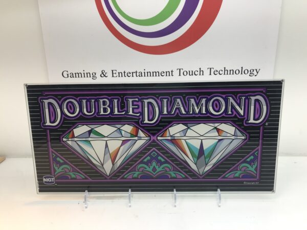 A IGT Double Diamond Belly Glass. 20.25" x 9.5". GETT Part BellyGlass100 sign is displayed in front of a gaming and entertainment company.