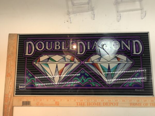 A IGT Double Diamond Belly Glass sign with two diamonds on it.