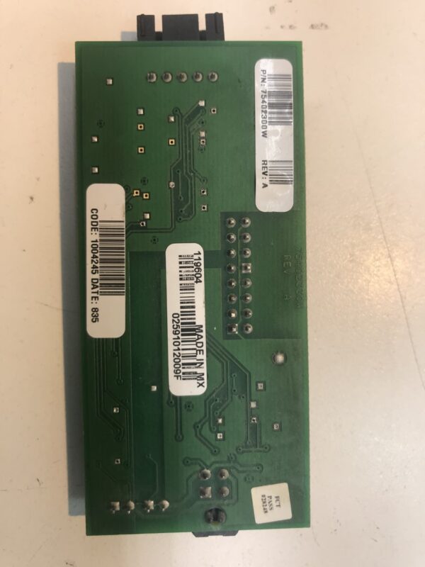 A green IGT PCB RS232 Daughter Board with a label on it.