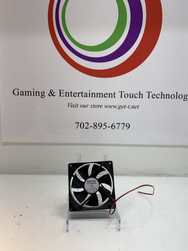 A CoolCox Cooling Fan- CoolCox- Part # CC9225H24B, 24V x.10A 3 WIRE NO CONNECTOR fan in front of a sign.