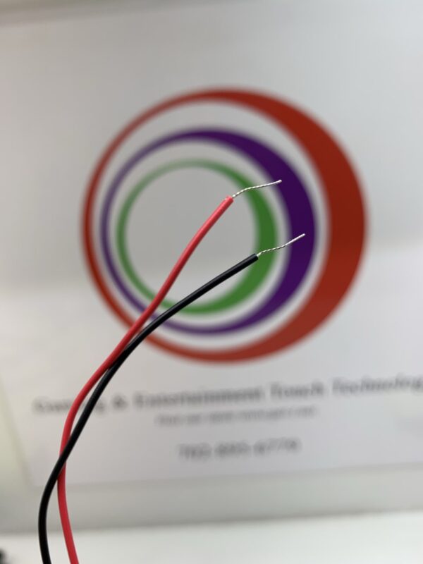 A pair of Cooling Fan- Delta Brand- Part # EFB0412HHA wires on a table next to a logo.