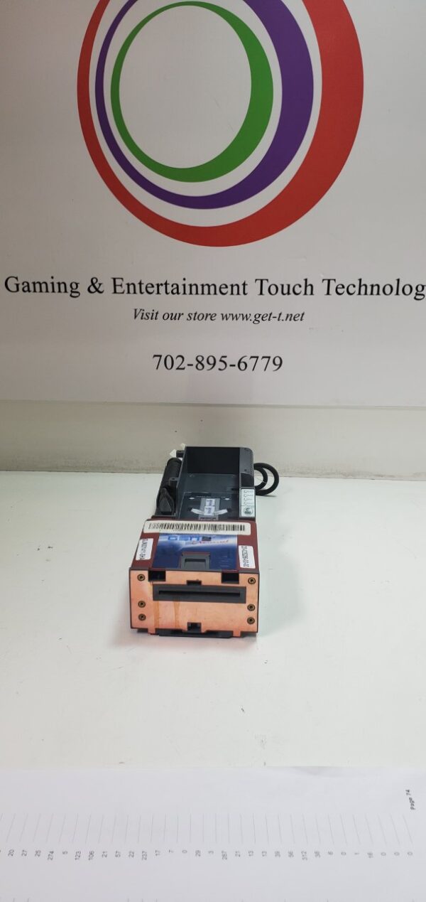 The FutureLogic Gen 2 Universal Ticket Printer. RS232 printer. GETT Part Ticket108 logo is sitting on a table.