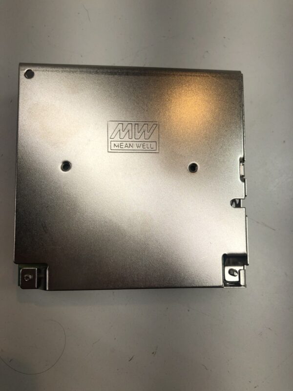 A metal plate on a table with a hole in it, the 12V Power Supply for use with PalTronics Progressive Jackpot Systems and Related parts. MW brand, Part # S-25-12. GETT Part PAL107.