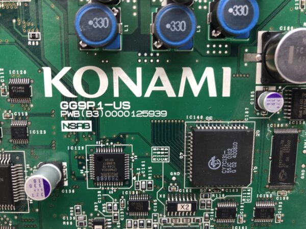 A close up of a circuit board with the Konami Game Board GG9P1-us With Diamond Solitaire Deluxe Software installed GETT Part CPU184 on it.