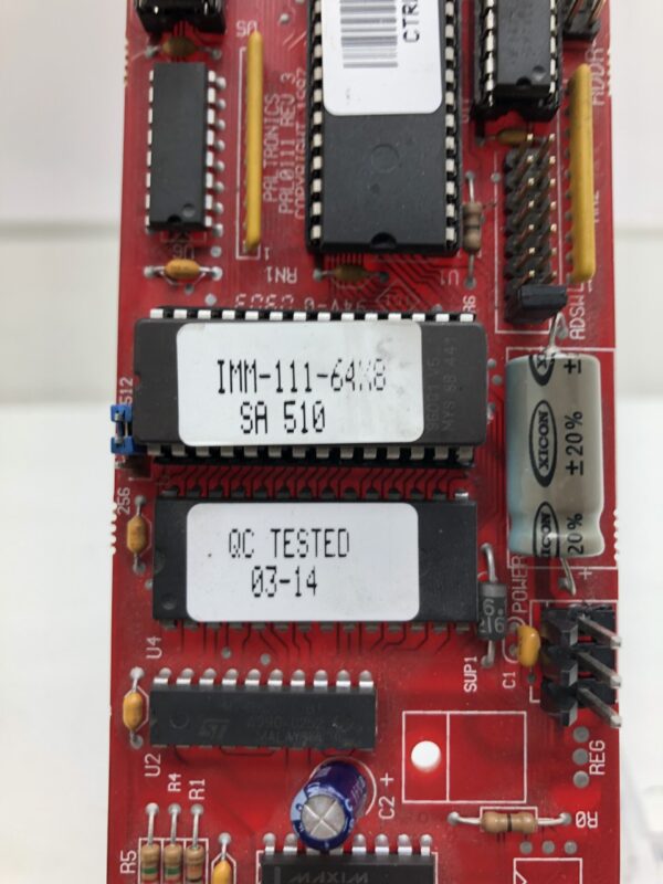 A red 12 cell in machine meter Controller Board with a number of electronic components on it.
