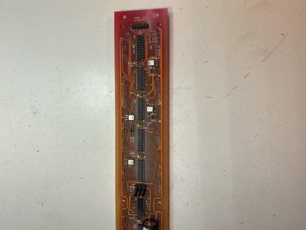 A piece of a 12 cell in machine meter Controller Board with a lot of wires on it.