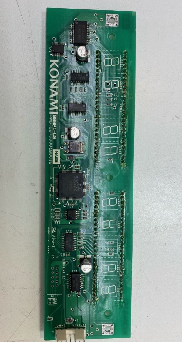 A green Power Control Board for Konami Gaming with electronic components on it.