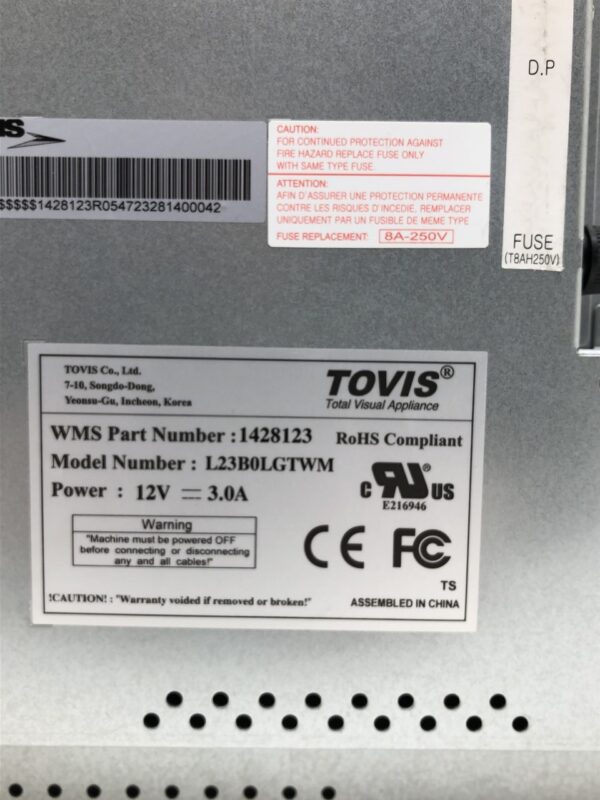 The back of a 23" Tovis #L23BOL3TWM with a label on it. GETT Part LCDM334.
