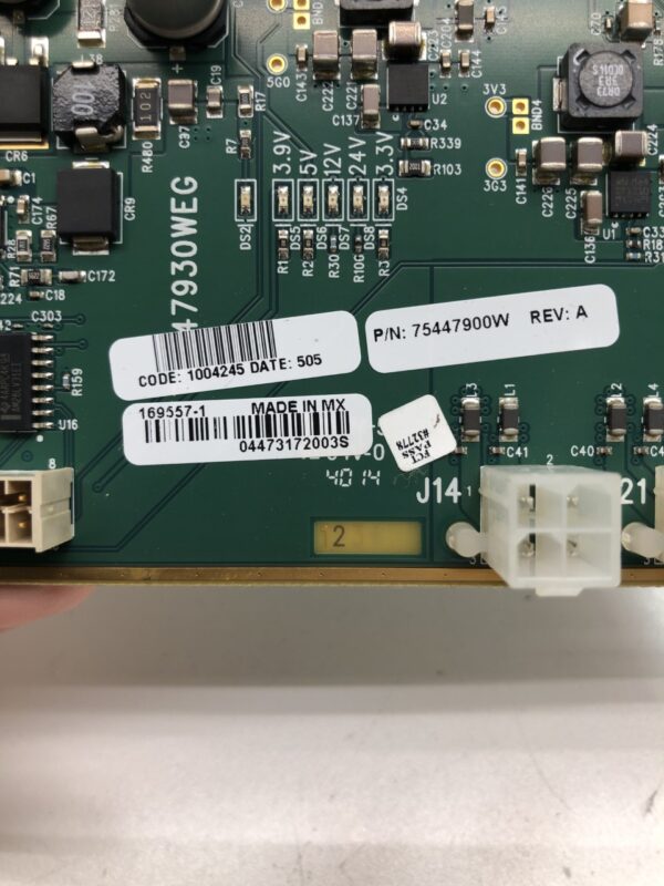 A person is holding up a Button Control Board assembly for IGT S3000 Game with a label on it.