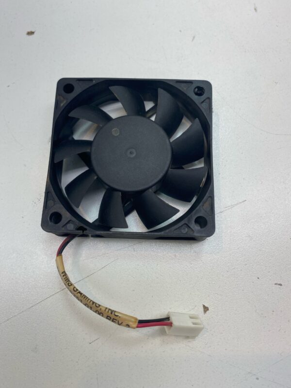 A 12V x 2.3W cooling fan on a white surface.