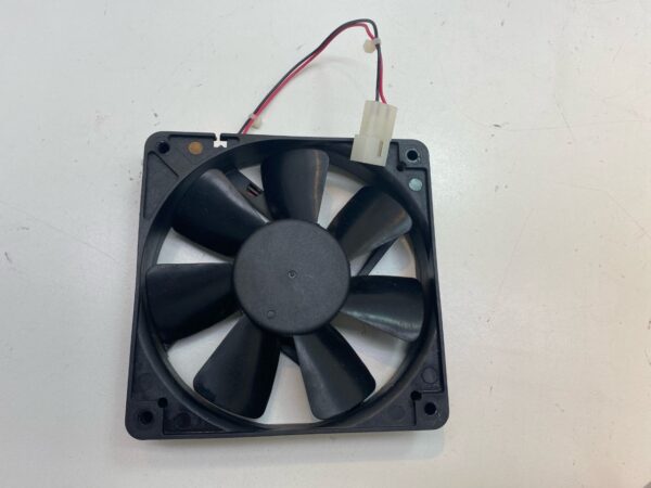 A 12V x .22A Large Cooling Fan on a white surface.