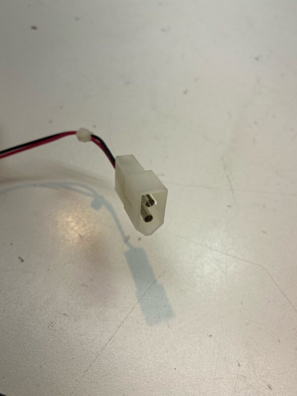 A white wire connected to a 12V x .22A Large Cooling Fan. PSC Brand Part RDM1225B2-22A. 2 Wire Fan with Connector. GETT Part Fan256 plug.
