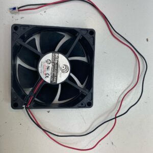 A 12V x .12A Cooling Fan on a white surface.