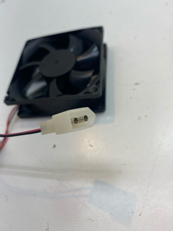 A small 24V x .15A Cooling Fan with a wire attached to it.