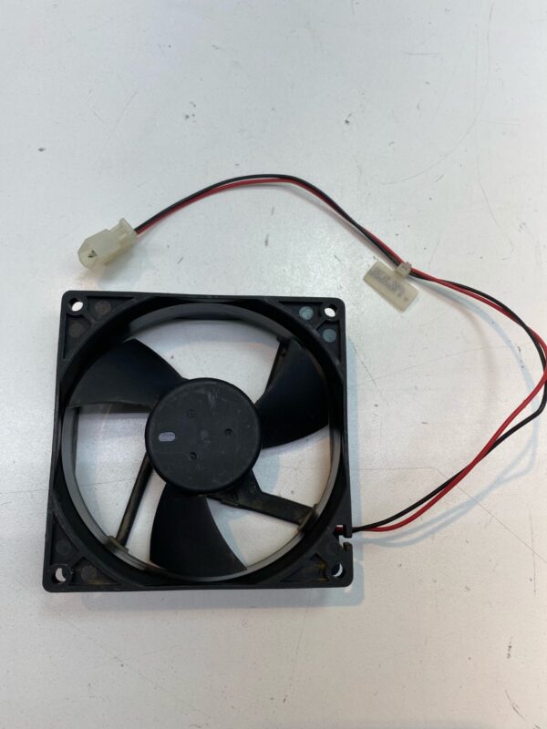 A 24V x .38A Cooling Fan. DC Brand, Part EFB0924SH. 2-wire fan with connector on a white surface.