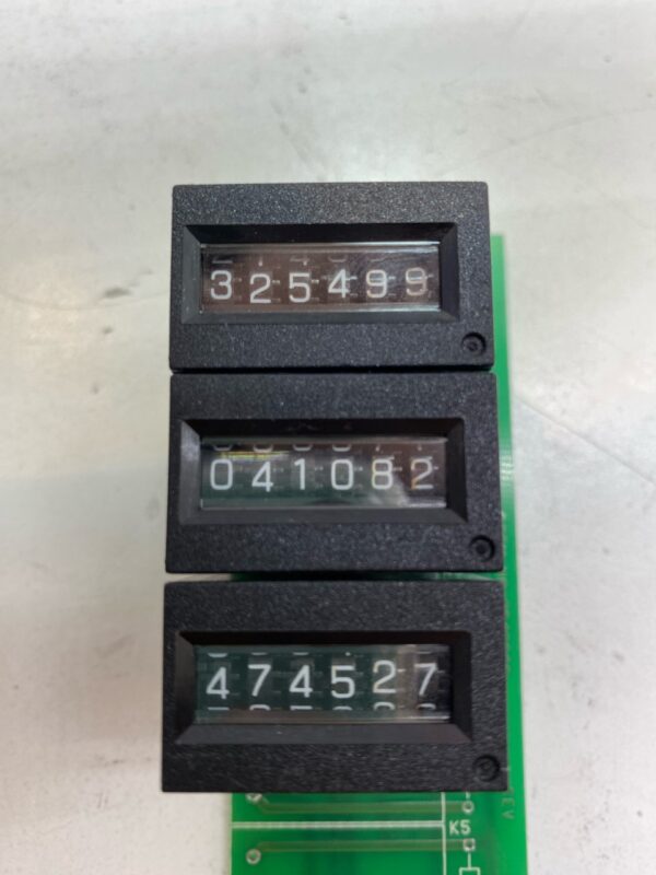 A Hard Meter for use with Slot Machines. Part # 75429800. GETT Part HardMeter100 on top of a circuit board.