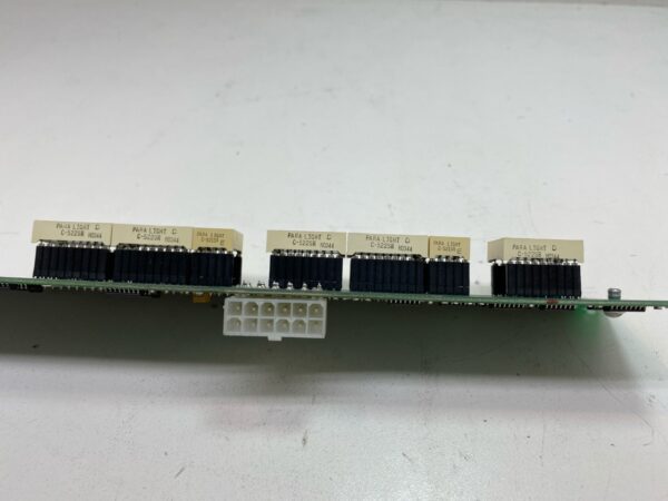 An IGT S2000 Machine 960 Stepper Seven Segment Display w/ Long Bracket with a number of pins on it.