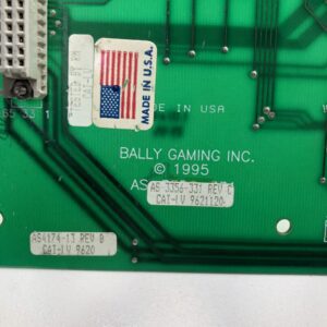 A green Motherboard for Bally Game Maker with an american flag sticker on it. Bally Part AS-3356-331 Rev D. GETT Part MBRD107.