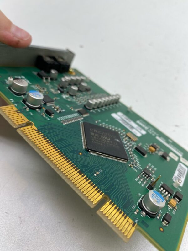 A person is using a tool to remove an IGT AUDIO CARD FOR AVP 2.5 CPU.