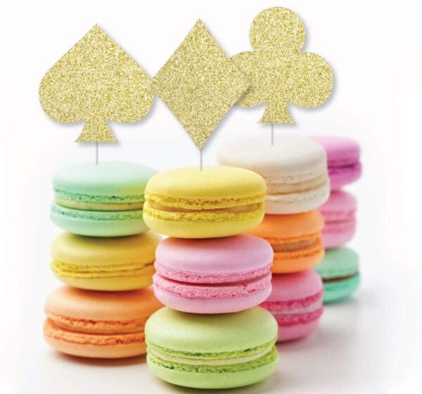 A stack of colorful macarons with Gold Glitter Card Suits - No-Mess Real Gold Glitter Cut-Outs - Las Vegas and Casino Party Confetti - Set of 24 on top.