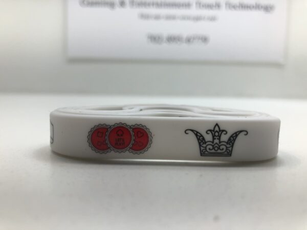 A 24 Pack Casino Night Theme Silicone Wristband Bracelet with a crown on it.