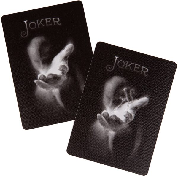 Two Ellusionist Bicycle Black Ghost Playing Cards - 2nd Edition with the word joker on them.
