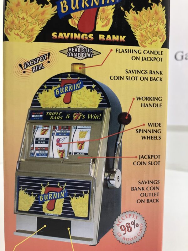 A box with a Burning 7's Slot Machine Bank with Spinning Reels in it.