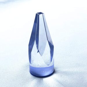A small blue glass bottle, the Roulette Win Marker. GETT Part CQG105, is sitting on a white surface.