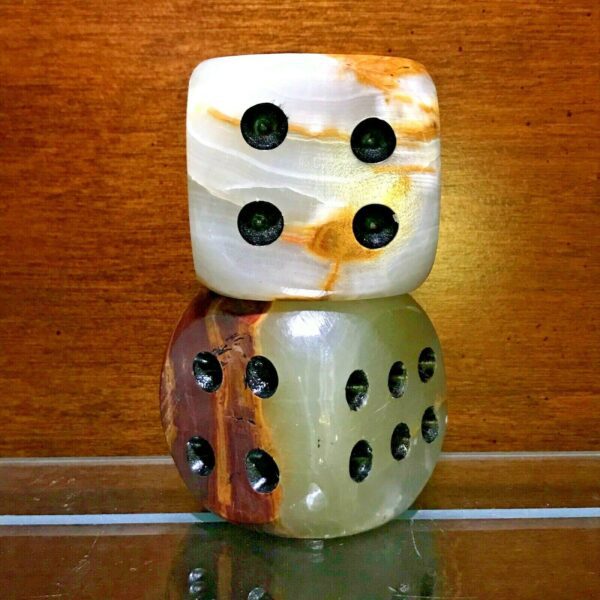 A set of Large Carved Onyx Mid-Century Modern Dice Sculptures - Set of 2 sitting on top of each other.