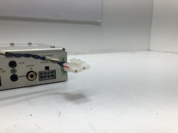 A small Amp for WMS BBI and BBII Games device with a wire attached to it.