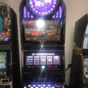 A Bally S9 with Spinner Top box slot machine in a casino.