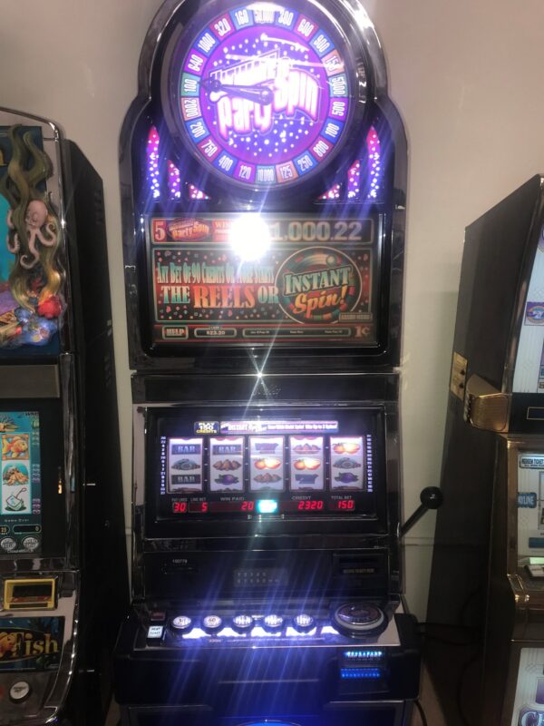 A Bally S9 with Spinner Top box slot machine in a casino.
