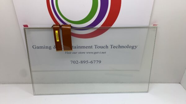 A glass panel with the words 27" PCap Touch sensor for use on IGT Crystal Core 27 on it.
