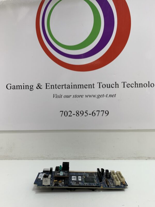 A IGT Player Tracking Unit SB2 LEGACY board in front of a sign.