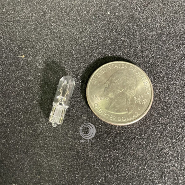 A dime next to a Light pro LED assembly replacement for F1 GETT Part LAMP191.