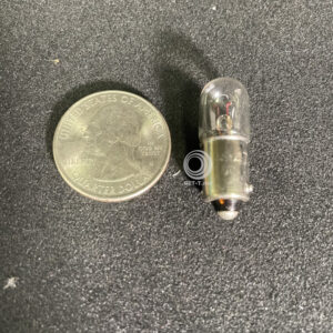 A small Light pro LED assembly replacement for F1 GETT Part LAMP191 next to a dime.